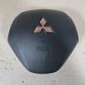 Оригинальная б/у Подушка безопасности в руль для Mitsubishi Outlander 3 GF (2012-2023 г.в.) в отличном состоянии с авторазбора "Гарант Разбор" в Санкт-Петербурге.