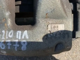 Суппорт тормозной передний левый Toyota Corolla E210 OEM 47750-02190 общий вид с фланцем крепления